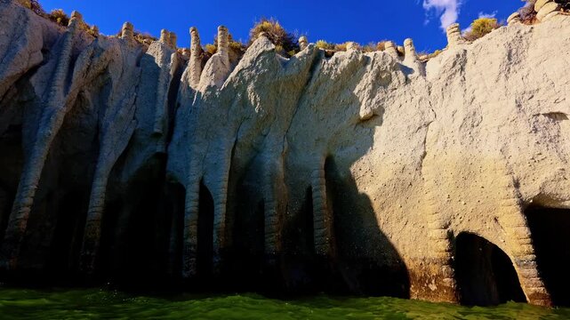 Vibrant sunset light glows over the famous Crowley Lake Stone Columns in California