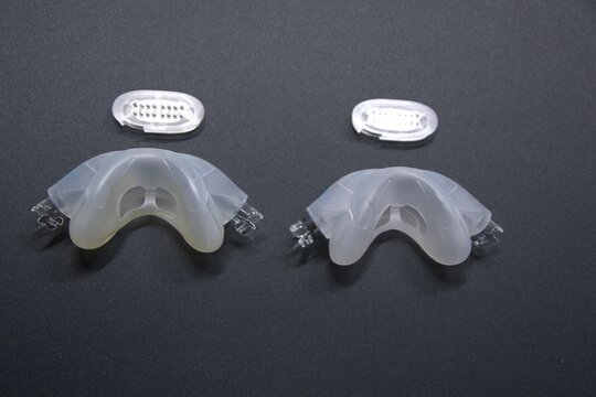 Old nasal CPAP mask or old nasal CPAP cradle cushion needs replacement for hygienic sleep apnea disorder therapy. Sleep apnea and sleep disorder with snoring stopped by respirator mask CPAP machine.