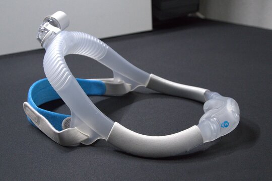 New nasal CPAP mask or new nasal CPAP cradle cushion improves sleep apnea disorder therapy and sleep comfort. Sleep apnea and sleep disorder with snoring stopped by respirator mask CPAP machine.