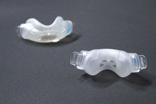Old nasal CPAP mask or old nasal CPAP cradle cushion needs replacement for hygienic sleep apnea disorder therapy. Sleep apnea and sleep disorder with snoring stopped by respirator mask CPAP machine.