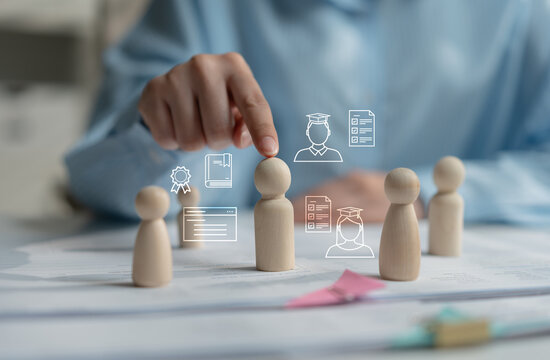 Human resources professional reviewing resumes and job applications for candidate selection, talent acquisition, employee evaluation, recruitment, hiring process and workforce management.