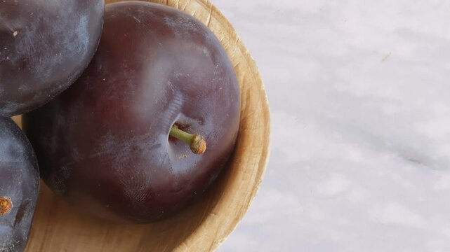 plums on a wooden table
