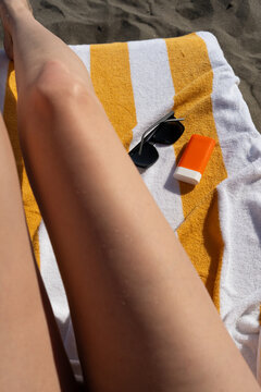 Lazy afternoon sun on sand and bare skin
