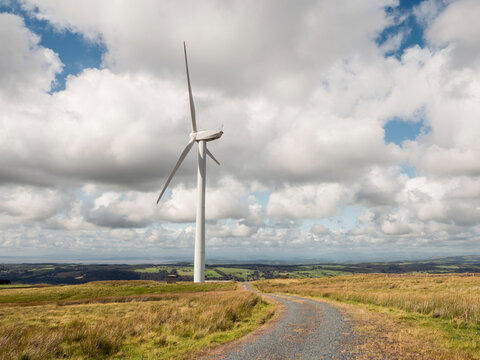Wind turbine on hill in open countryside