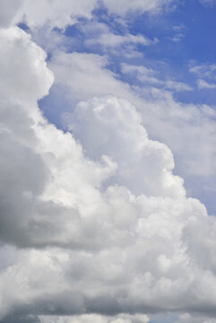 Weather: Huge cumulonimbus clouds forming, rising to great heights. A precursor to a violent summer storm.