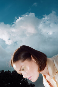Surreal Woman Portrait Under Cloudy Sky