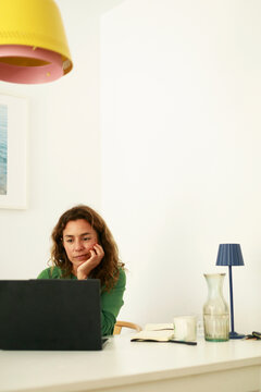 Woman Working at Desk With Laptop 