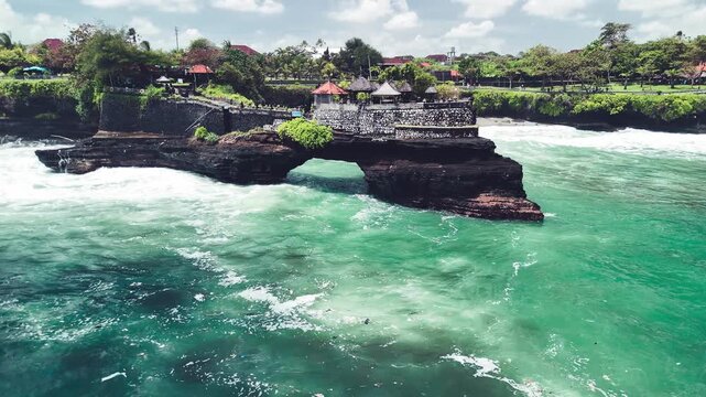 Drone footage of Pura Batu Bolong and Tanah Lot during