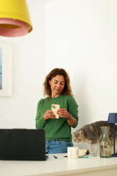 Woman Using Phone in a Bright Room 
