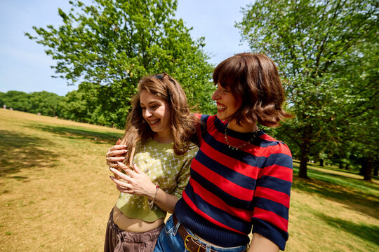 Mother and daughter enjoy time together outside.