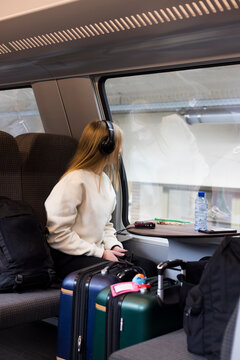 Girl traveling by train in Europe