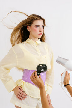Woman model posing with hair blowing