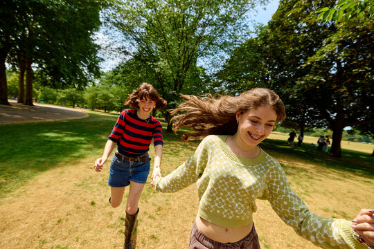 Mom and daughter have fun at the park.