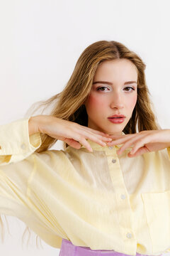 Woman wearing yellow shirt with long hair