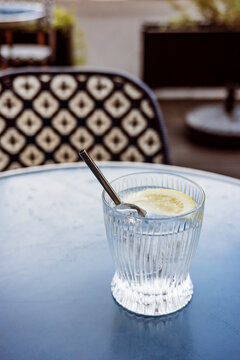 Refreshing Drink With Lemon Slice on a Table in a Cafe
