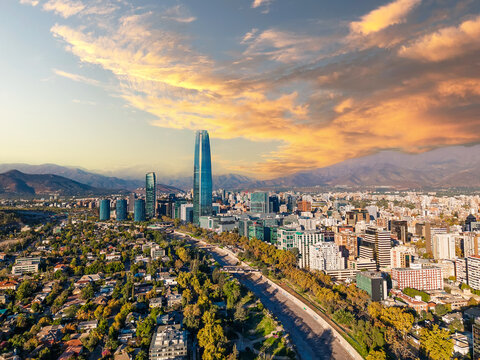Aerial view of Santiago city skyline and Andes mountains at sunset