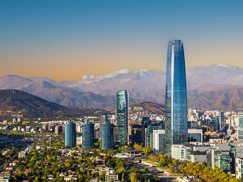 Panoramic view of the Santiago city skyline with skyscraper and the Andes mountains in the background, Chile