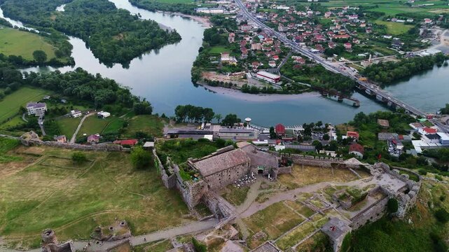 Aerial view of Rozafa Castle ruins perched on a rocky hill overlooking the winding rivers and city of Shkod&euml;r, Albania travel destination in Balkans Europe 