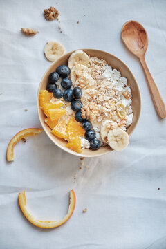 Healthy breakfast with oatmeal cereal, banana, blueberry, orange