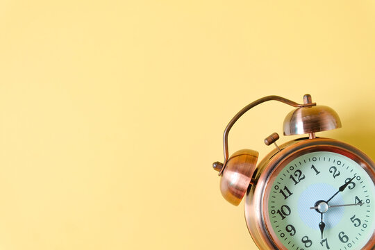 Vintage Alram clock on color background.