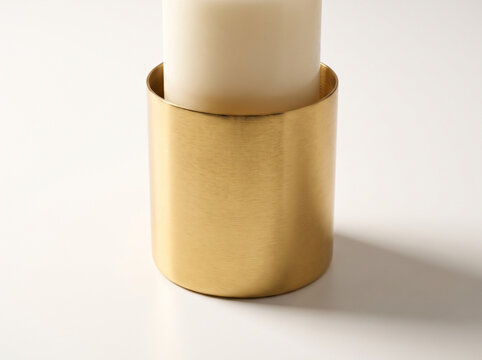 Elegant Gold Cylindrical Candle Holder on White Surface