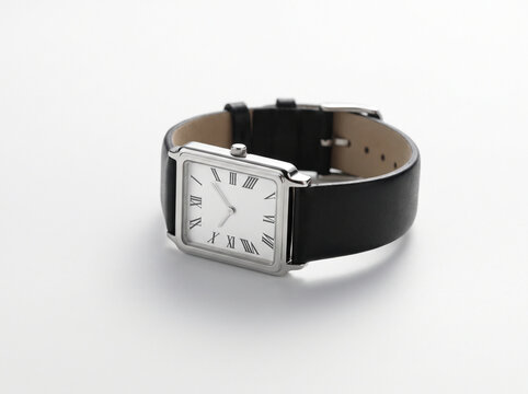 Elegant Rectangular Silver Wristwatch with Black Leather Strap on White Surface