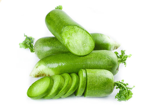 Fresh Green Chinese Radishes from Tianjin with Sliced Pieces Showing Crispy White Flesh on White Background