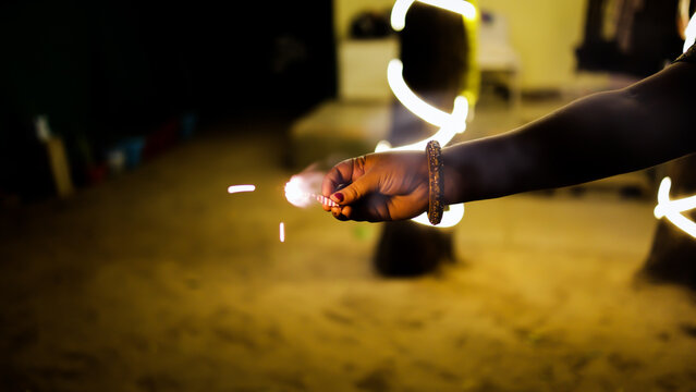 women hand With Sparkler Firework During Indian Festival Of Lights diwali Celebration