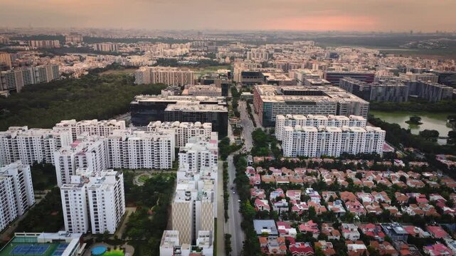 Aerial drone view of rapidly expanding residential and commercial real estate in Bangalore, Karnataka, India, featuring modern apartment complexes, construction projects, and the city's fast-growing u