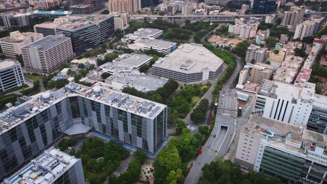 Aerial drone view of a modern IT park in Bangalore, Karnataka, India, featuring corporate office buildings, technology campuses, and the rapidly growing urban business district.