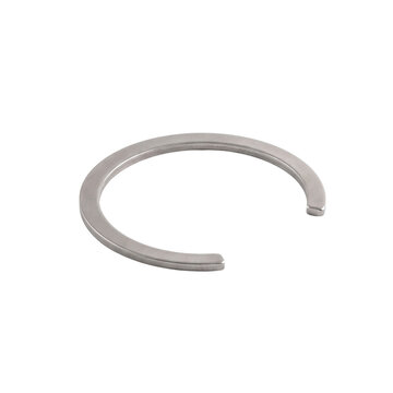 Metal snap ring on white background. Industrial retaining clip for mechanical engineering.