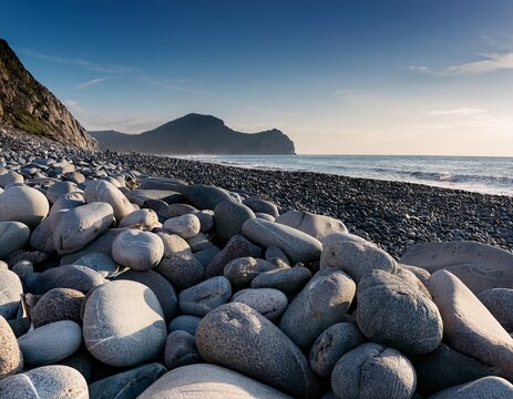 a rocky beach with a large pile of rocks