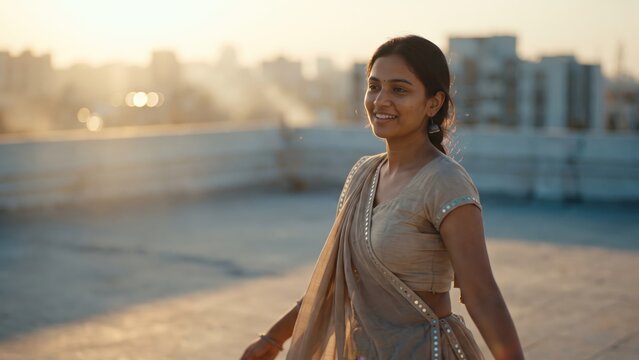 Young Woman Practicing Garba at Sunset &ndash; Rooftop Navratri Preparation