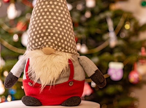 Festive Christmas Gnome Decoration in Front of a Blurred Tree
