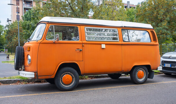 Vintage german minibus Volkswagen Bulli parked on a city street. Milan / Italy - July 31, 2026.