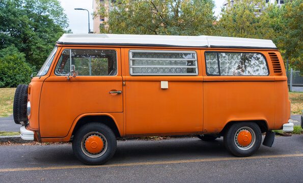 Vintage german minibus Volkswagen Bulli parked on a city street. Milan / Italy - July 31, 2026.