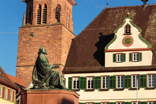 Johannes Kepler monument with St. Peter and Paul Church and historic half-timbered buildings in Weil der Stadt, Germany.