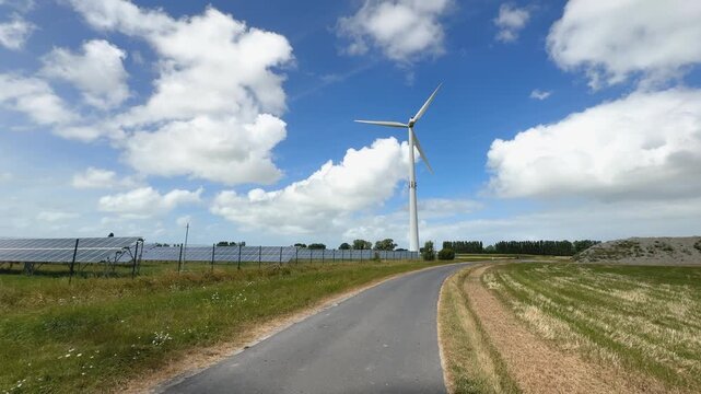 Wind turbine and solar panels in rural West Flanders, Belgium