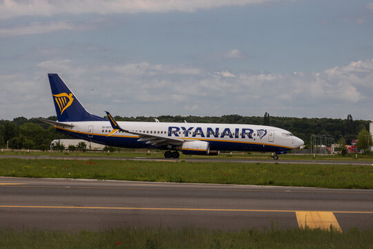 Ryan Air commercial passenger airplane taxiing on the asphalt tarmac and takeoff at an airport runway in Romania