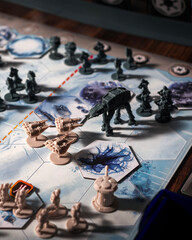 Fototapeta premium AT AT walkers advancing against Rebel forces during the Battle of Hoth on a detailed tabletop battlefield with defensive towers