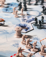 Fototapeta premium Rebel defense tower surrounded by infantry on a Battle of Hoth tabletop battlefield with dramatic lighting as Imperial forces advance across the snowy terrain in a cinematic perspective