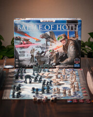 Fototapeta premium Portrait product photography of Star Wars Battle of Hoth board game with components and box displayed with dramatic lighting