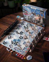 Fototapeta premium Portrait product photography of Star Wars Battle of Hoth board game with components and box displayed with dramatic lighting