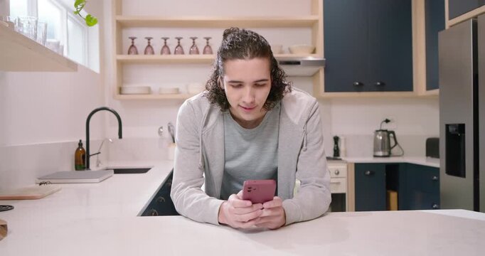 Adult African male receiving message, reading pink smartphone in light zip hoodie at island smiling