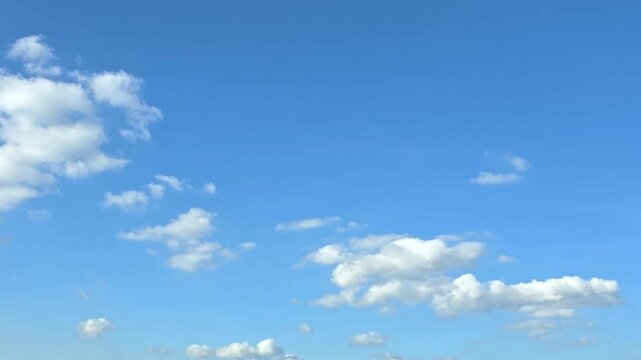 Cloudscape, Timelapse of Blue Sky with Fluffy White Cumulus Clouds along Horizon for Background and Banner Design	