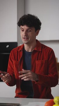 IT developer having online video call on laptop, discussing project with client
