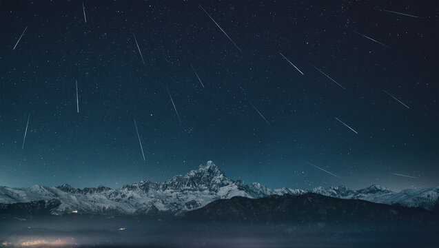 Geminidi meteor shower on a clear winter sky above Monviso and the snow-covered Cottian Alps in Piedmont.