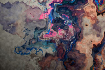 Fototapeta premium Abstract marble background with vibrant pink and blue fluid ink patterns.