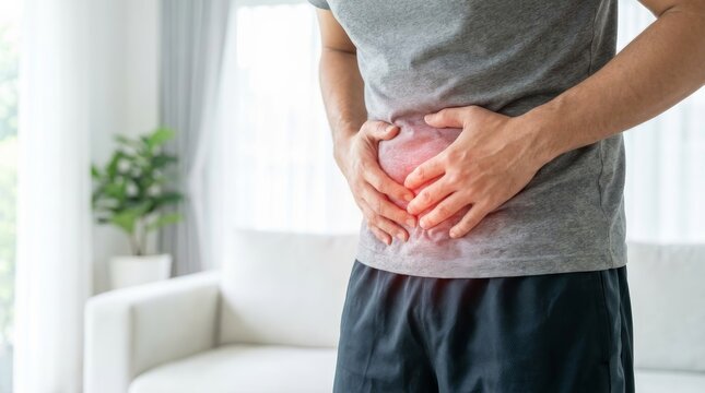 Abdominal pain and digestive issue symptoms shown by a man holding his belly.