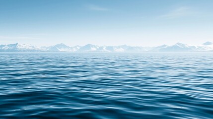 Obraz premium Tranquil scene of a clear sky mirrored in deep blue ocean water, framed by distant, snow capped mountains
